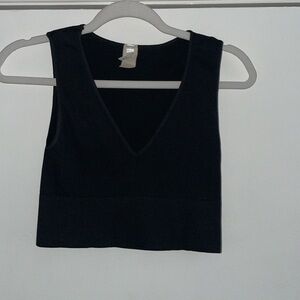 NIKIBIKI  Black Ribbed Seamless Knit Crop Plunging V-Neckline Bralette Top | OS